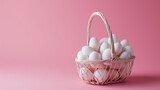 Minimal composition with shopping basket full of white Easter eggs against pastel pink background
