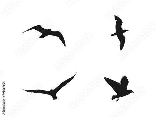 flying seagull silhouettes set. A flock of flying birds. Flight bird silhouettes, isolated black doves or seagulls collection. Freedom metaphor vector illustration. isolated on white background.