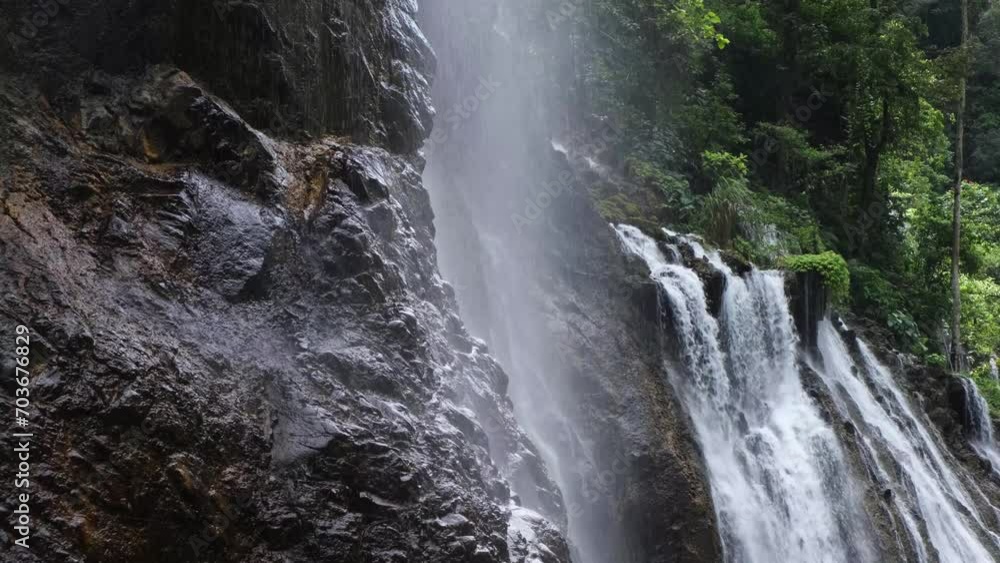 Beautiful valley with waterfalls of water falling on the rocks creating a gentle drizzling effect Beautiful valley with waterfalls of water falling on the rocks creating a gentle drizzling effect