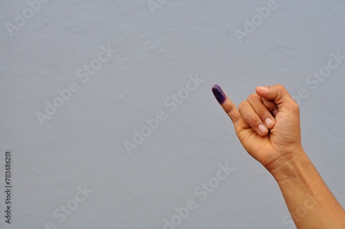 little finger after voting on Indonesia's presidential election photo