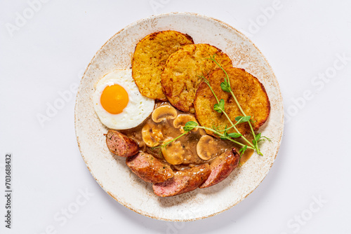 potato pancakes with sausage and fried egg