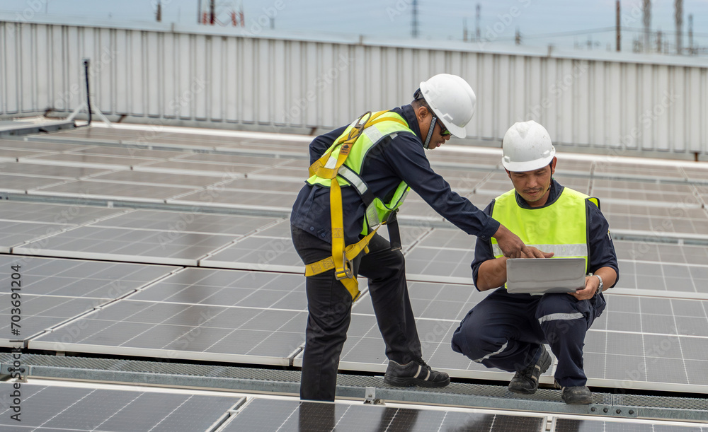 Concept of solar cell service and maintenance, engineering and maintenance man on site job for check and install solar panel on roof of factory.