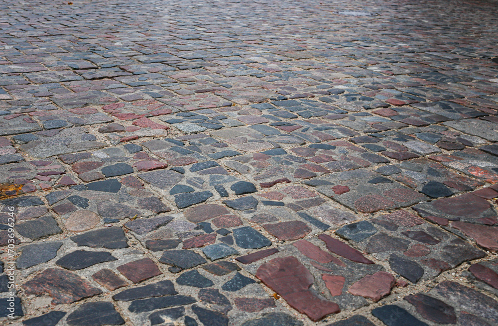 Abstract background of old cobblestone pavement close-up. Abstract background of old cobblestone pavement close-up.