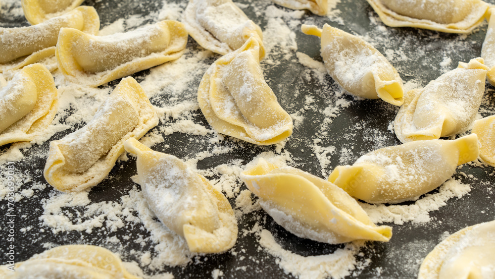 A kind of ravioli, casoncelli, home made traditional food of the Bergamo area, Italy. Delicious Italian food. Black background