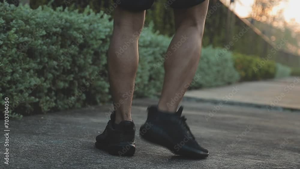 Athlete runner feet running on road, Jogging concept at outdoors. Man running for exercise. Athlete runner feet running on road, Jogging concept at outdoors. Man running for exercise.