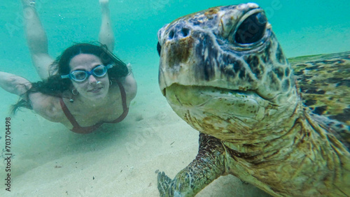 young woman with wild turtle in Sri Lanka