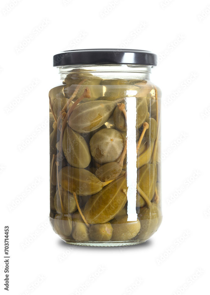 Caper berries, pickled in a glass jar. Whole ripe caper bush fruits