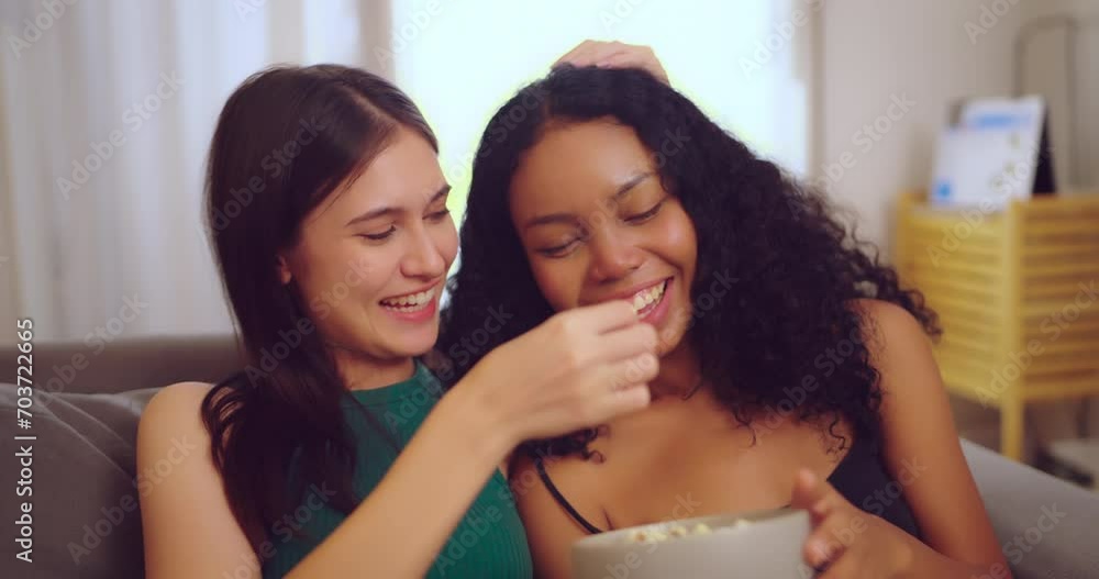 Young couple lesbian watching tv in living room together. Lifestyle, Happiness, Relaxation, Leisure and LGBT concept. Young couple lesbian watching tv in living room together. Lifestyle, Happiness, Relaxation, Leisure and LGBT concept.