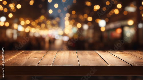 wooden top table with bokeh light effect and blurred background at night photo
