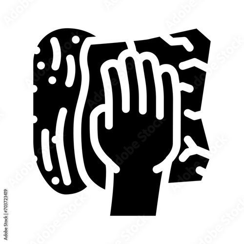 soaking spills with paper towel glyph icon vector. soaking spills with paper towel sign. isolated symbol illustration