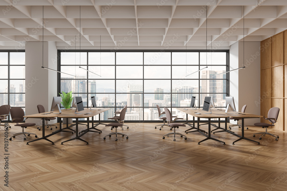 Fototapeta premium Stylish office interior with chairs, pc computers and table in row near window