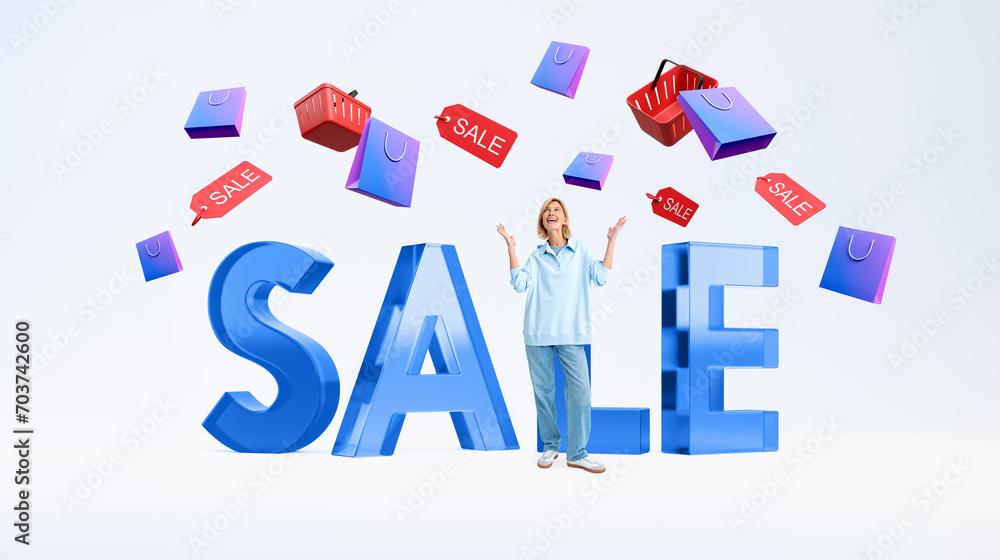 Woman with raised hands standing near glass sale word, falling shopping basket Woman with raised hands standing near glass sale word, falling shopping basket