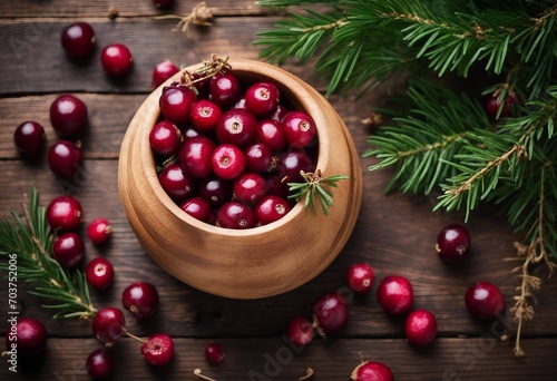 Ripe fresh cranberry in wooden bowl on rustic table top view