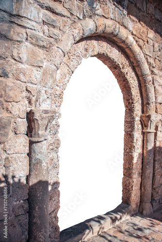 Backyard doorway in a stone wall on white background. Beige brick textured wall png. Sant Miquel del Fai