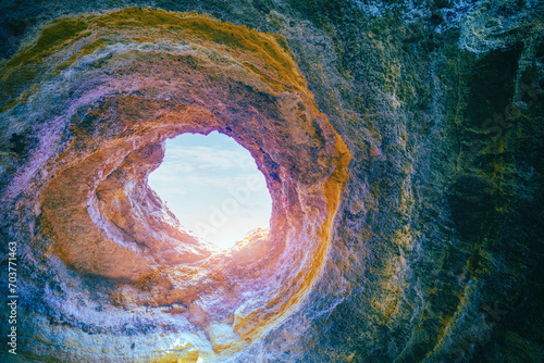 Coastal rocky seascape, hole of Benagil cave in Algarve region in Atlantic ocean, Portugal, Europe photo