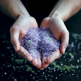Close Up of Hands Mixing Salt and Flowers