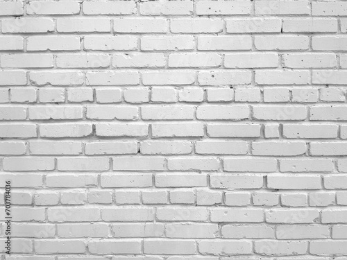 Brick wall painted with white paint