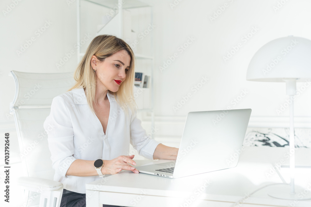 Beautiful business woman at her personal office working on her desk. Beautiful business woman at her personal office working on her desk.