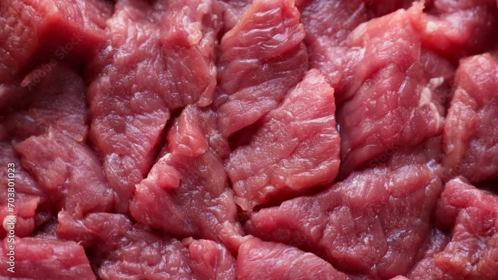 Fresh raw red beef meat slices circle rotation close up top view Fresh raw red beef meat slices circle rotation close up top view