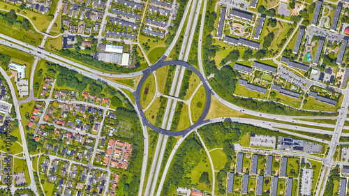 Raod, highway, flyover road junction - spaghetti and roundabout looking down aerial view from above, bird’s eye view expressway and intersection landscape, Malmo, Sweden