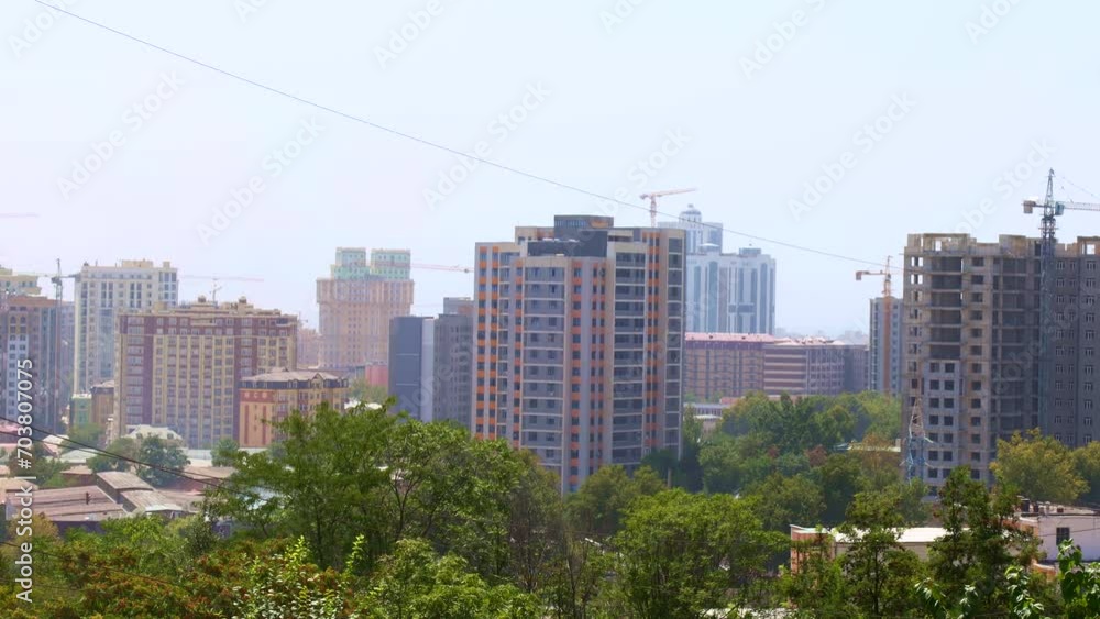 The city view of Dushanbe streets and buildings on blue sky background The city view of Dushanbe streets and buildings on blue sky background