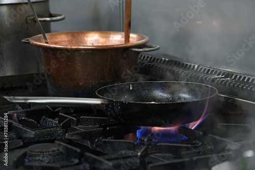 pot and pan on the fire of a real kitchen