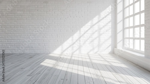 Empty white-colored room with a large brick wall  maple floor