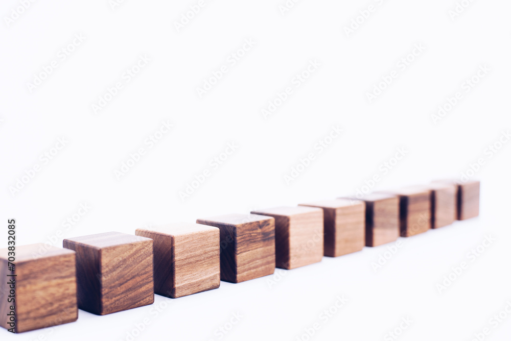 Obraz premium Scattered wooden cubes on a white background. Blocks