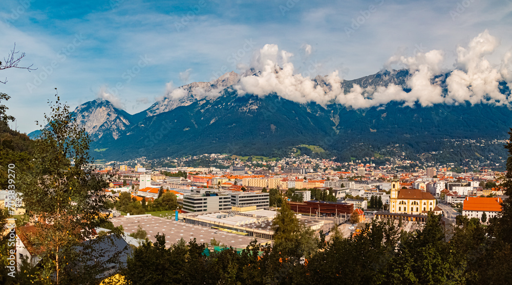 High resolution stitched alpine summer panorama with cloudy Nordkette mountains in the background near Innsbruck, Tyrol, Austria