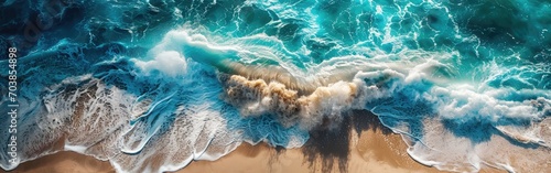 Aerial view of a beach with a blue wave