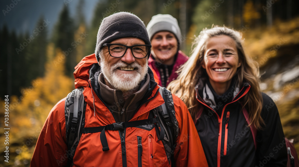 Group of senior various national people hiking through the forest and mountains together Group of senior various national people hiking through the forest and mountains together