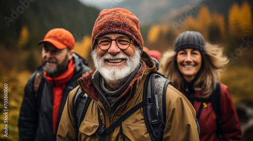 Group of senior various national people hiking through the forest and mountains together © Migma_Agency