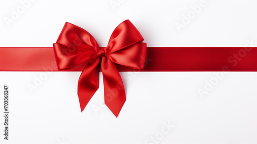 bright red ribbons tied in a bow on white background 