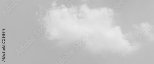 White cloud in the sky. View on a soft white fluffy cloud as background. Cloudy sky, white clouds, grey background pattern. 