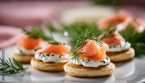 Mini blinis topped with smoked salmon, a dollop of crame fraache, and a sprig of dill
