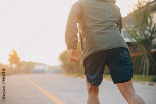 Athlete runner feet running on road, Jogging concept at outdoors. Man running for exercise..Athlete runner feet running on road, Jogging concept at outdoors. Man running for exercise.