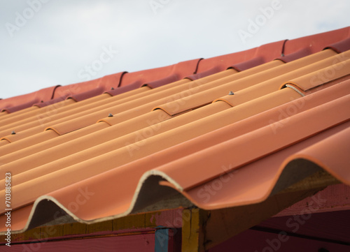 Prefabricated orange tile roof in simple house construction