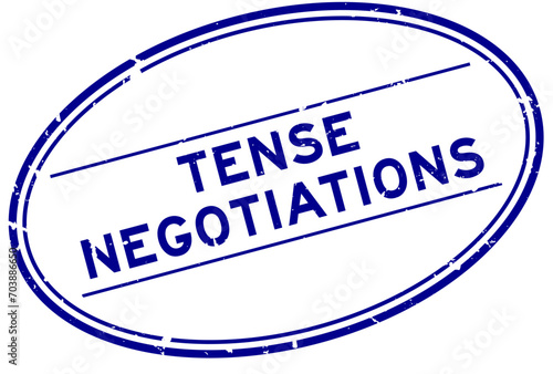 Grunge blue tense negotiations word oval rubber seal stamp on white background