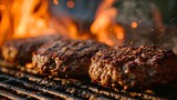 Sizzling juicy beef hamburger patties cooking to perfection on a smoky barbecue grill, with flames licking the edges, over real charcoal for that authentic grilled flavor.