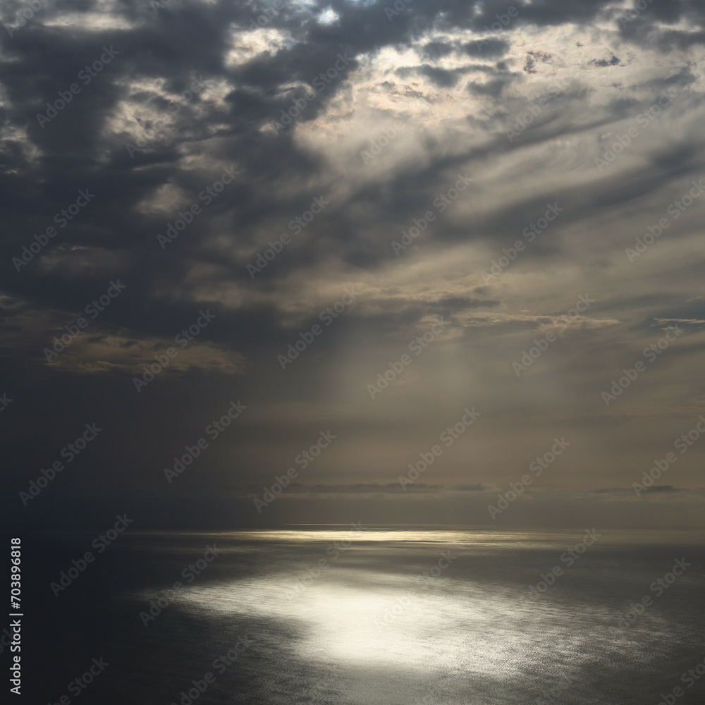 Clouds and sunstreak over the sea Clouds and sunstreak over the sea