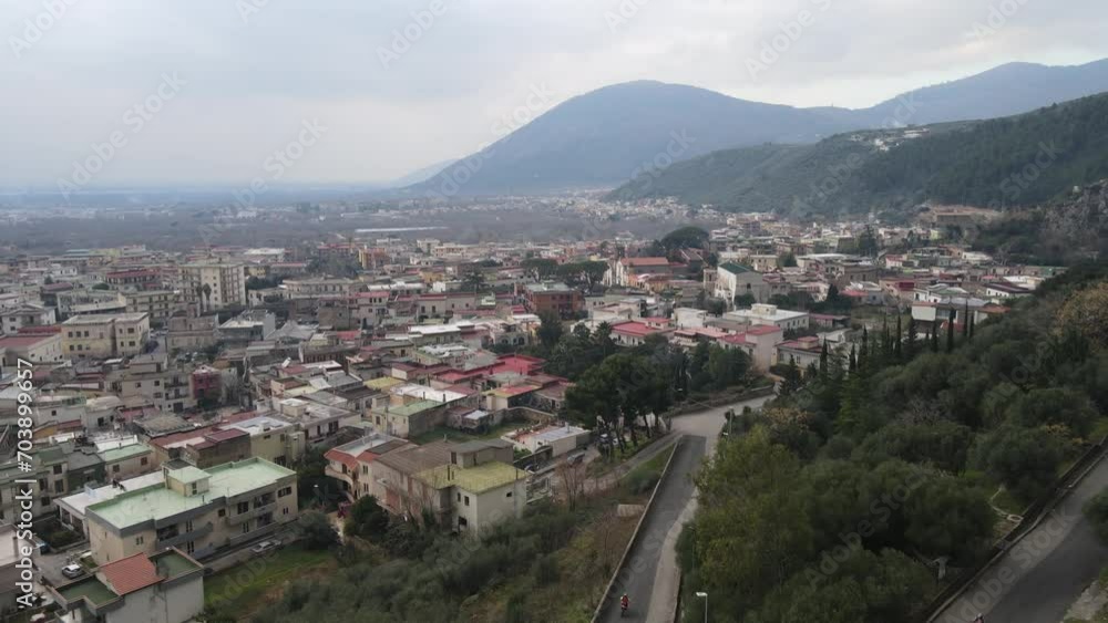 A panoramic view of a small town, nestled in the mountains, in southern Italy A panoramic view of a small town, nestled in the mountains, in southern Italy