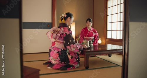 Japanese women, traditional tea ceremony and friends with respect, kindness and relax with bow at table. Girl, people and together for drink, matcha or indigenous clothes with cup, culture and home