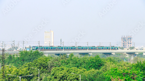 Picture of Noida Metro or Noida Metro Rail Corporation and It's Campus. Noida metro arriving at the metro station in Noida, Uttar Pradesh, India