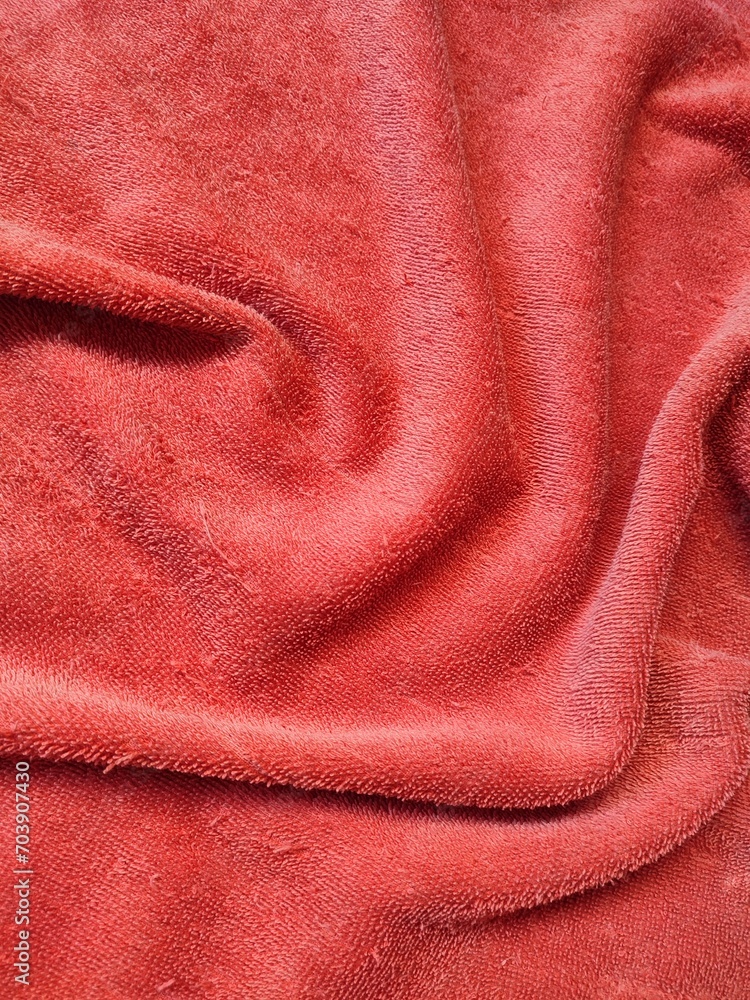 texture, pattern, background of red towel exposed to sunlight texture, pattern, background of red towel exposed to sunlight