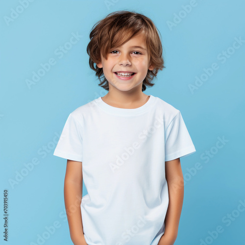 happy child in blank t-shirt on an isolated blue background 