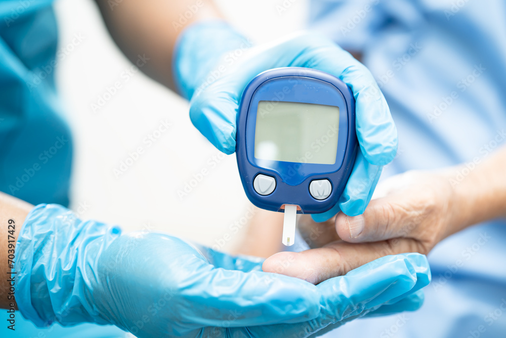 Doctor check diabetes from finger blood sugar level with finger lancet. Doctor check diabetes from finger blood sugar level with finger lancet.