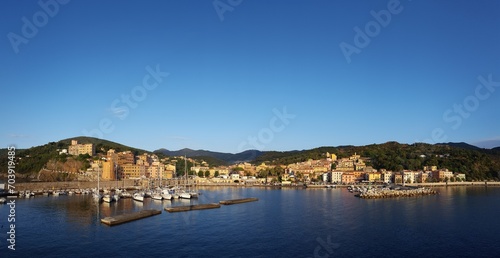A picturesque harbor bustles with vessels of all sizes © Picstocker