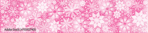 Panoramic elegant snowflake background in soft pink pastel colors. Snowflake wallpaper. Winter wonderland. Blizzard background. Soft pink wintry banner for social media or website.