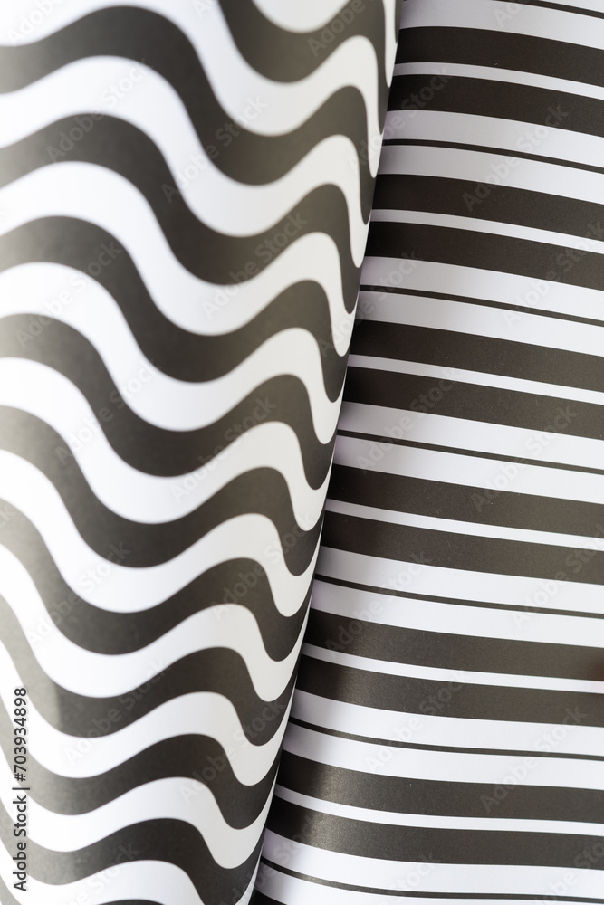 background featuring two black and white patterns, one wavy the other straight background featuring two black and white patterns, one wavy the other straight