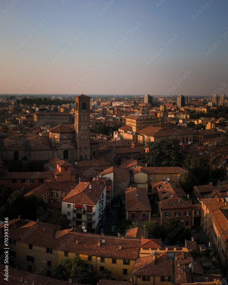 Bologna in the morning light from above, view from the sky, city landscape panoramic low sun view, Italian architecture from drone